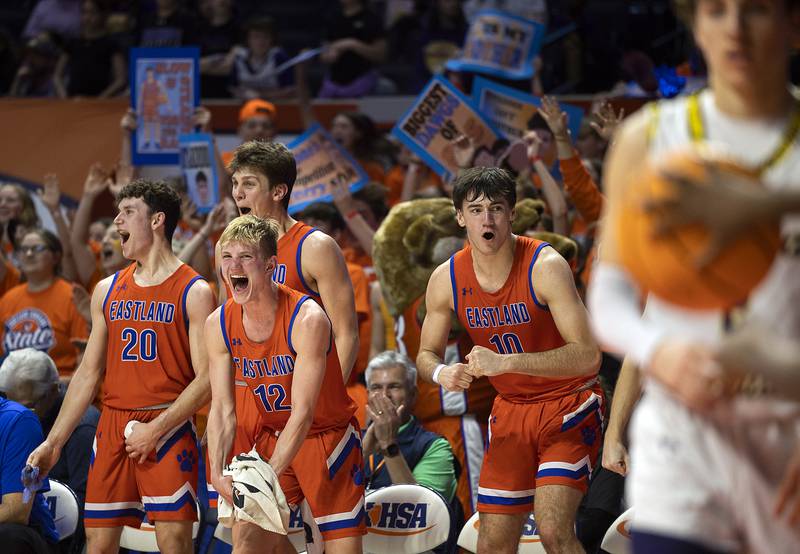 Eastland celebrates celebrates the final seconds of their win over Peoria Christian Thursday, March 13, 2025, during the Class 1A boys basketball state semifinal.