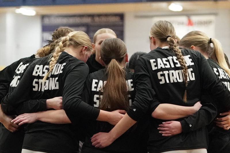 Oswego East players huddle up before tip off during a basketball game against Oswego at Oswego East High School on Saturday, January 14, 2017.