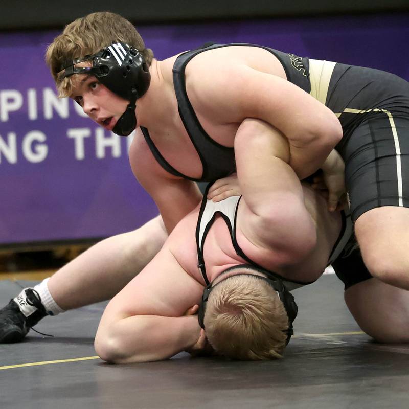 Sycamore’s Clyde Nott controls Kaneland’s Garrett Herst during their 215 pound match Thursday, Jan. 9, 2025, at Sycamore High School.