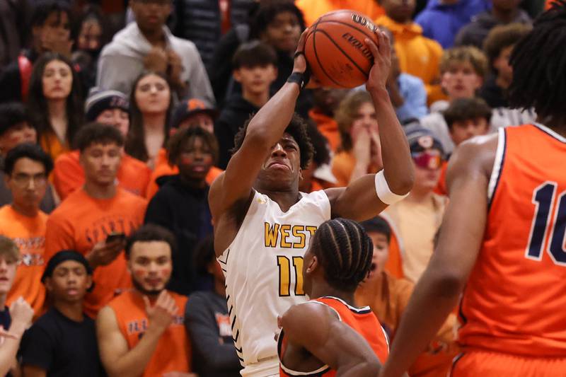 Joliet West’s Jeremy Fears puts up the contest three point shot against Romeoville on Tuesday January 31st, 2023.