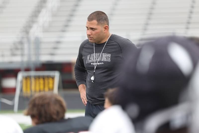 Plainfield North head coach Anthony Imbordino huddles up with the team after a scrimmage against Joliet Catholic on Thursday, July 13th, 2023 at Plainfield North