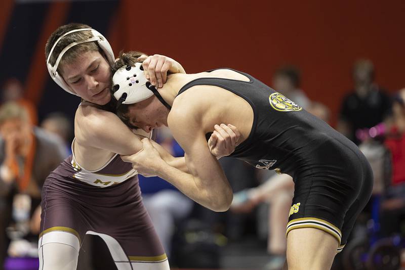 Batavia’s Kai Enos (right) works against Morris’ Paxton Valentine in the 2A 120 pound class Saturday, Feb. 21, 2026, at the IHSA wrestling finals in Champaign.
