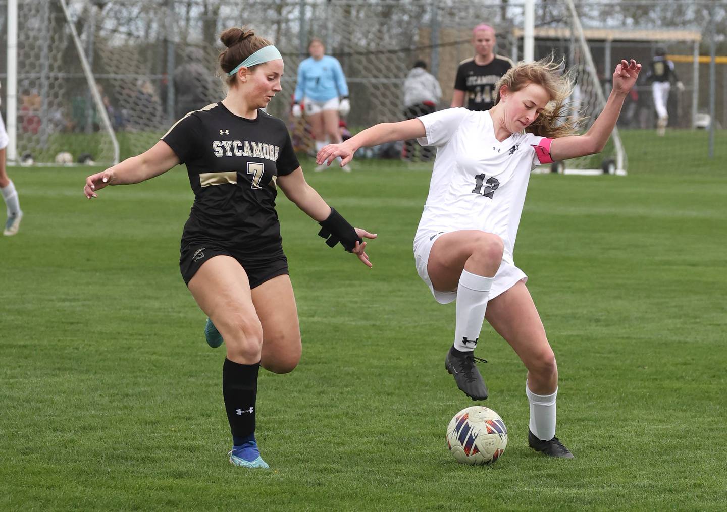 Kaneland's Casey O'Brien tries to put a move on Sycamore's Anya Berry during their game Wednesday, April 17, 2024, at Sycamore High School.