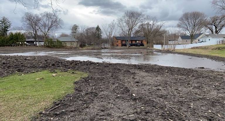 The site of a rain garden being constructed by the city of Crystal Lake and the Wildflower Preservation and Propagation Committee, is a major flood-prone site, as shown here in a photo from this past winter, taken by city engineer Kevin Lill.