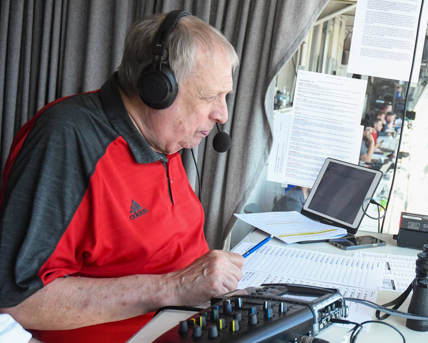 Bill Baker, U.S. Air Force veteran and Northern Illinois University's radio announcer, speaks during a broadcast as NIU takes on Tulsa University on Saturday, Sept. 23, 2023, at Huskie Stadium in DeKalb.