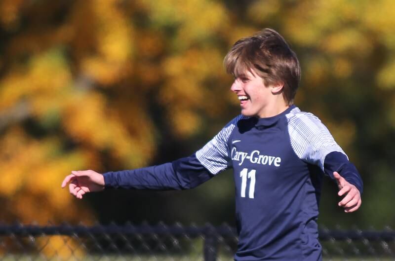 Cary-Grove’s Ethan Doyle gets revved up after scoring against Harvard in IHSA Class 2A Regional Title Game soccer action on Saturday, Oct. 26, 2024, at  Harvard Junior High School  in Harvard.