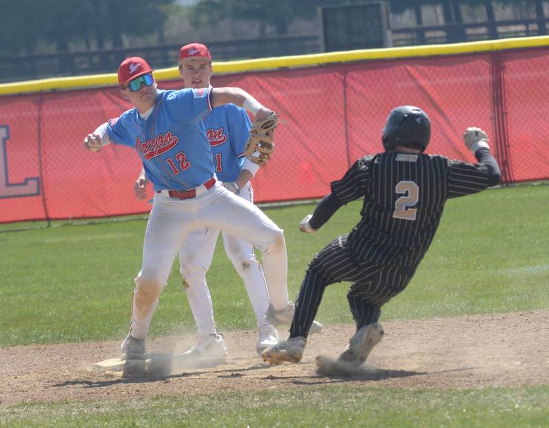 Oregon's Gavin Morrow steps on second and throws to first for the double play during a game against Rockford Christian at Oregon High School on Saturday, April 12, 2025.