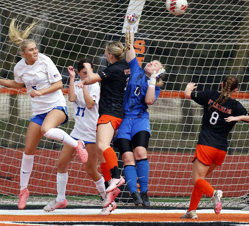 St. Charles North's Lauren Korioth (0) knocks the ball away during a corner kick during the championship game of the Rose Augsburg Drach Invitational Saturday, March 29, 2025 in St. Charles Ill.