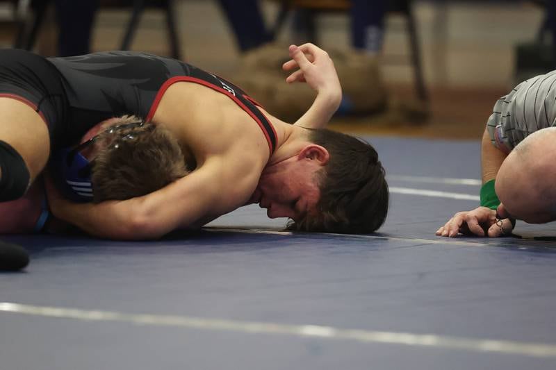Plainfield North’s Luke Grindstaff looks to moves to pin Plainfield South’sKyle McCormick in a Southwest Prairie dual meet on Wednesday, Nov. 29, 2023 in Plainfield.