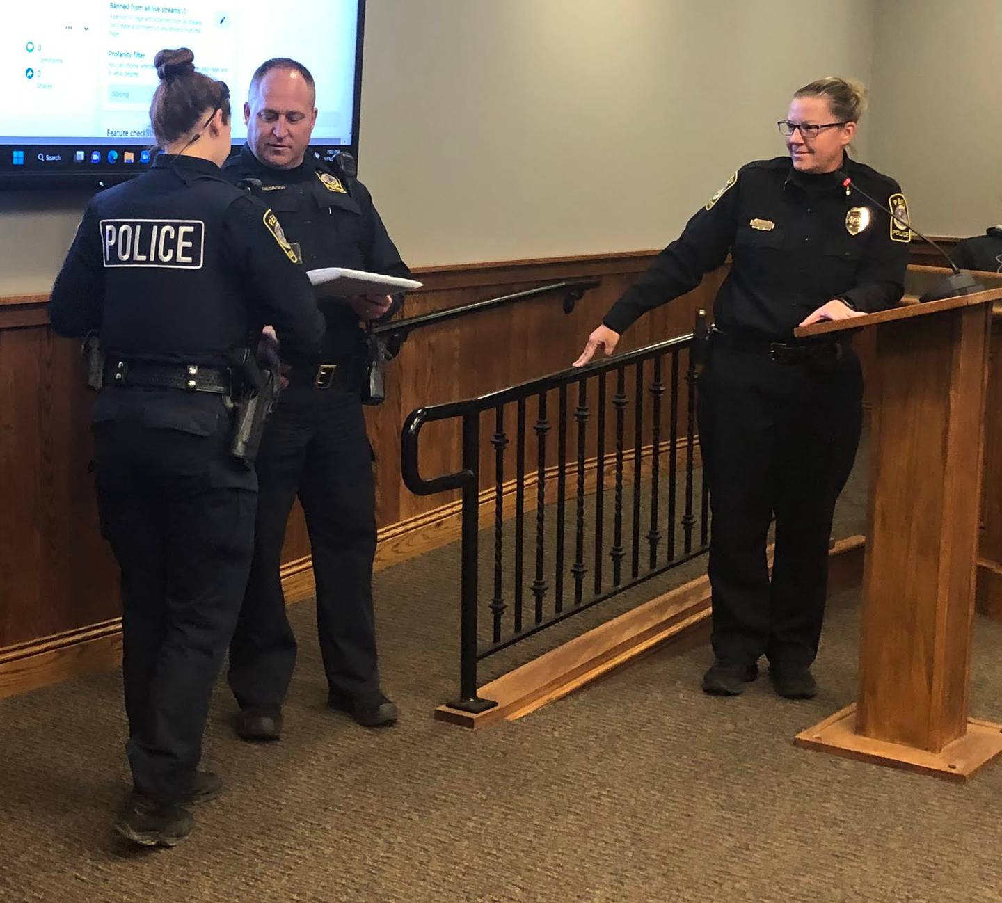 Peru police officer Michelle Leary (left) is given a lifesaving award for her actions in saving a woman's life on Monday, Feb 13, 2023 during a City Council meeting.