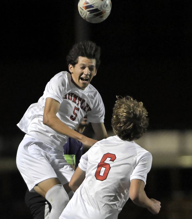 Huntley’s Noah Gomez heads the ball in an IHSA Class 3A boys soccer sectional semifinal game against Hampshire in Streamwood on Oct. 30, 2024.
