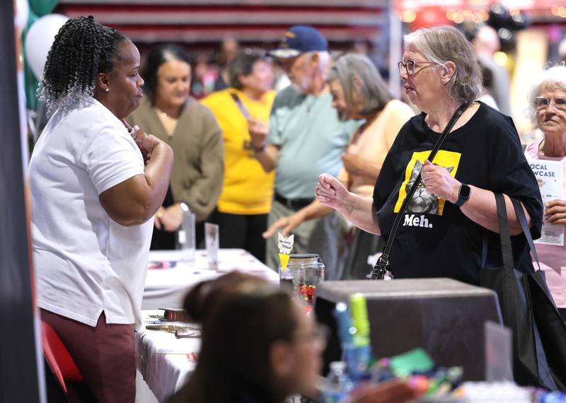 Visitors check out the booths Thursday, April 23, 2026, at the DeKalb Chamber of Commerce Local Showcase in the Convocation Center at Northern Illinois University in DeKalb.