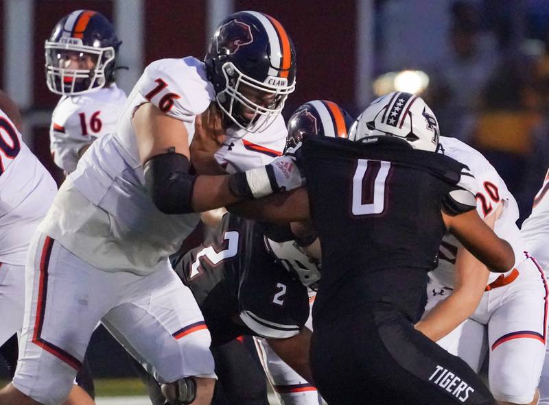 Oswego’s Gustavo Guzman (76) blocks Plainfield North's Kevin Wilson (0) during a football game at Plainfield North High School on Friday, Sept. 22, 2023.