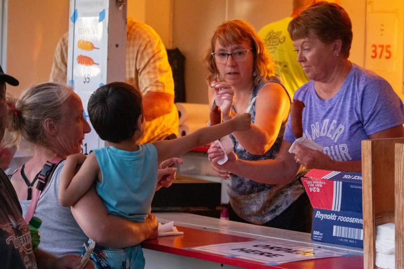 People of Mendota buy corn dog on Saturday, June 29, 2024 at Lake Mendota.
