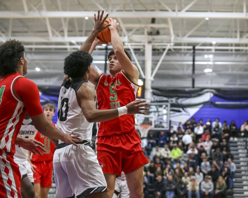 LaSalle Peru's Erick Sotelo (5) goes up with a shot during their Plano Christmas Classic semi-final basketball game between Kaneland at LaSalle Peru Monday, Dec 29, 2025 in Plano.