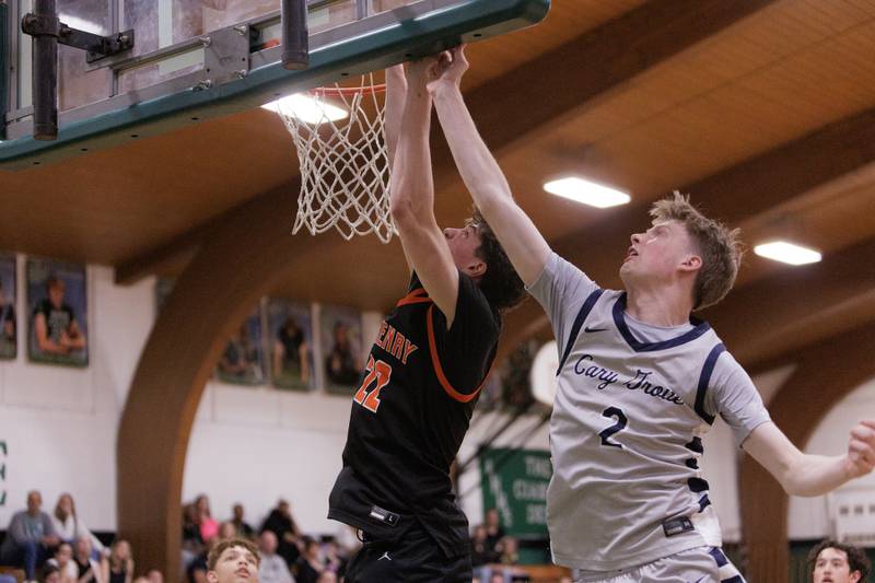 McHenry's Blake Renfro (left) goes in for the layup against Cary-Grove's AJ Berndt at the McHenry County Area All-Star Basketball Extravaganza on Sunday, April 12, 2026, at Alden-Hebron.