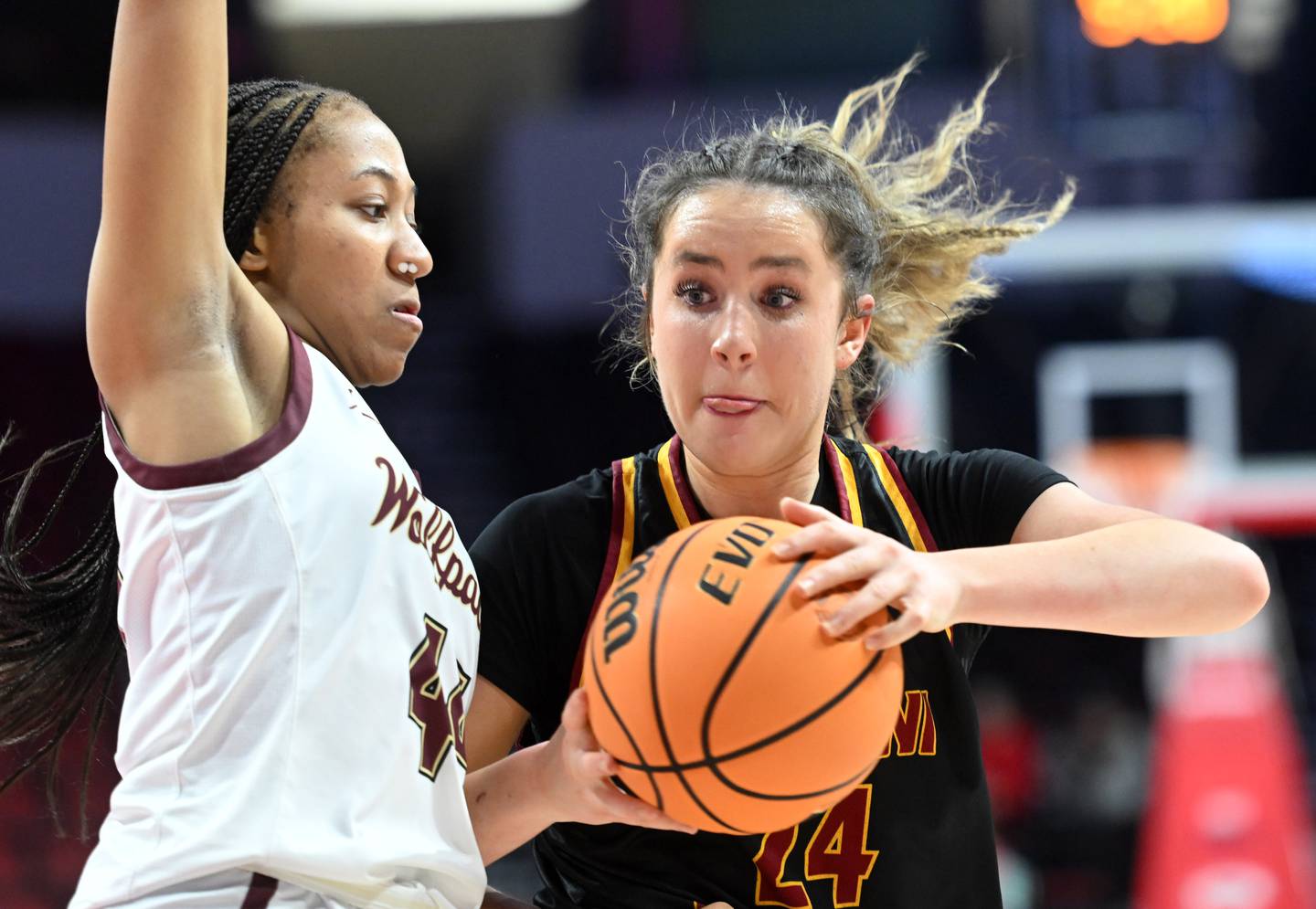 Montini's Peyton Farrell, right, makes a move to the basket against St. Ignatius' Gabby Hinton during the IHSA Class 3A girls state basketball championship game at CEFCU Arena on Saturday, March 8, 2025 in Normal.