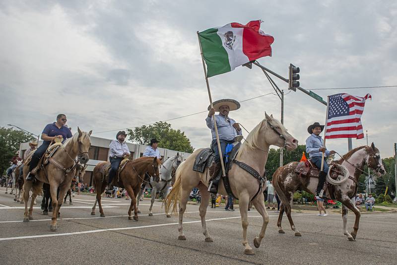 Horseback riders with Rancho El Capricho finish off the Fiesta Parade on Saturday in Rock Falls and Sterling.