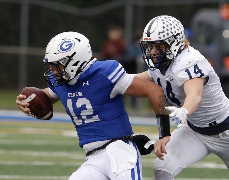 Cary-Grove's Ostin Hansen tries to tackle Geneva’s Anthony Chahino during an IHSA Class 6A semifinal football game on Saturday, Nov. 23, 2024, at Geneva High School.