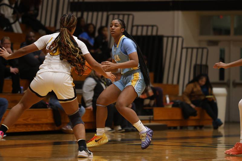 Joliet Catholic’s Gabrielle Gavin works the ball against Marian Catholic on Wednesday, Jan. 14, 2026 in Chicago Heights.