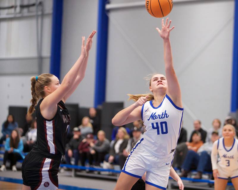 St. Charles North's Elle Fuhr puts the shot up against Prairie Ridge's Winter Gallivan at the Burlington Central Tournament on Tuesday, Nov. 19,2024 in Burlington.