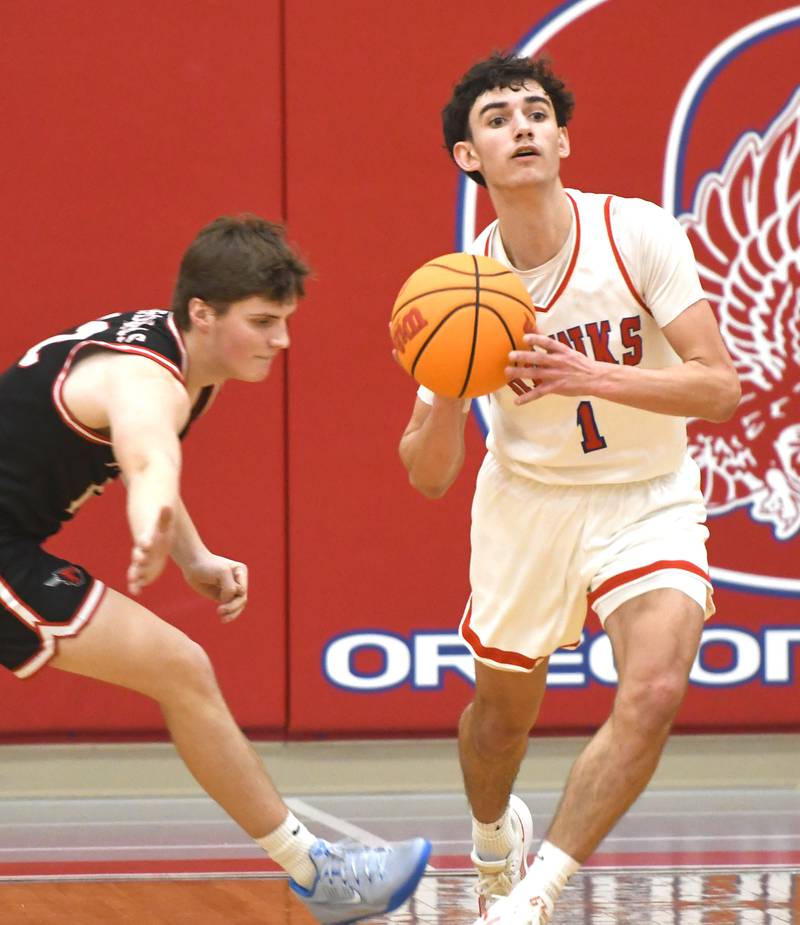 Oregon's Benny Olalde passes to the outlet for a fast break against Forreston on Tuesday, Feb. 17, 2026 at the Blackhawk Center in Oregon.