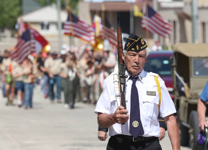A member of American Legion Post 99 heads east on Elm Street Monday, May 29, 2023, during the Sycamore Memorial Day parade.