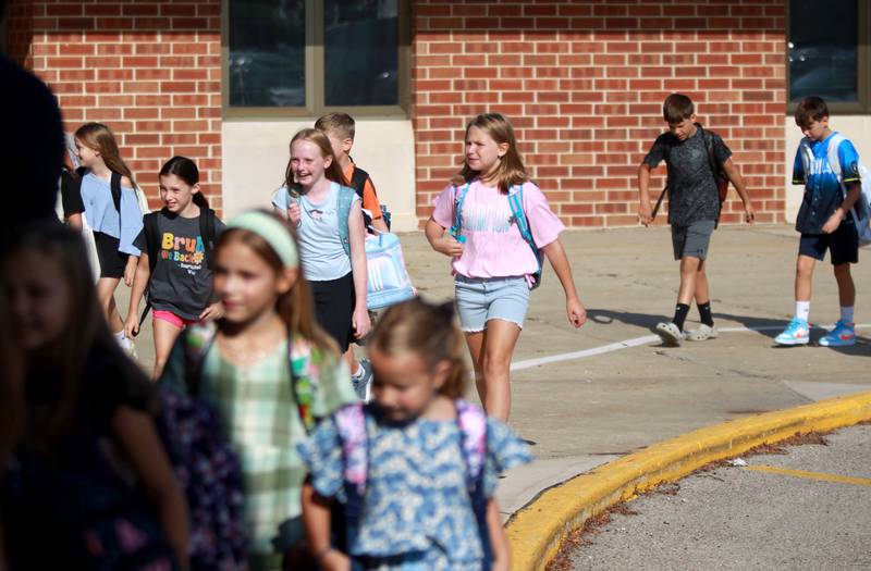 Students arrive for the first day of school at Fox Ridge Elementary School in St. Charles on Wednesday, Aug. 14, 2024.
