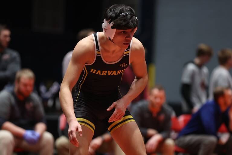 Harvard’s Ivan Rosas faces off against Unity’s Tavius Hosley  in the Class 1A 145 pound dual team 3rd place match at Grossinger Motor Arena in Bloomington. Saturday, Feb. 26, 2022, in Champaign.