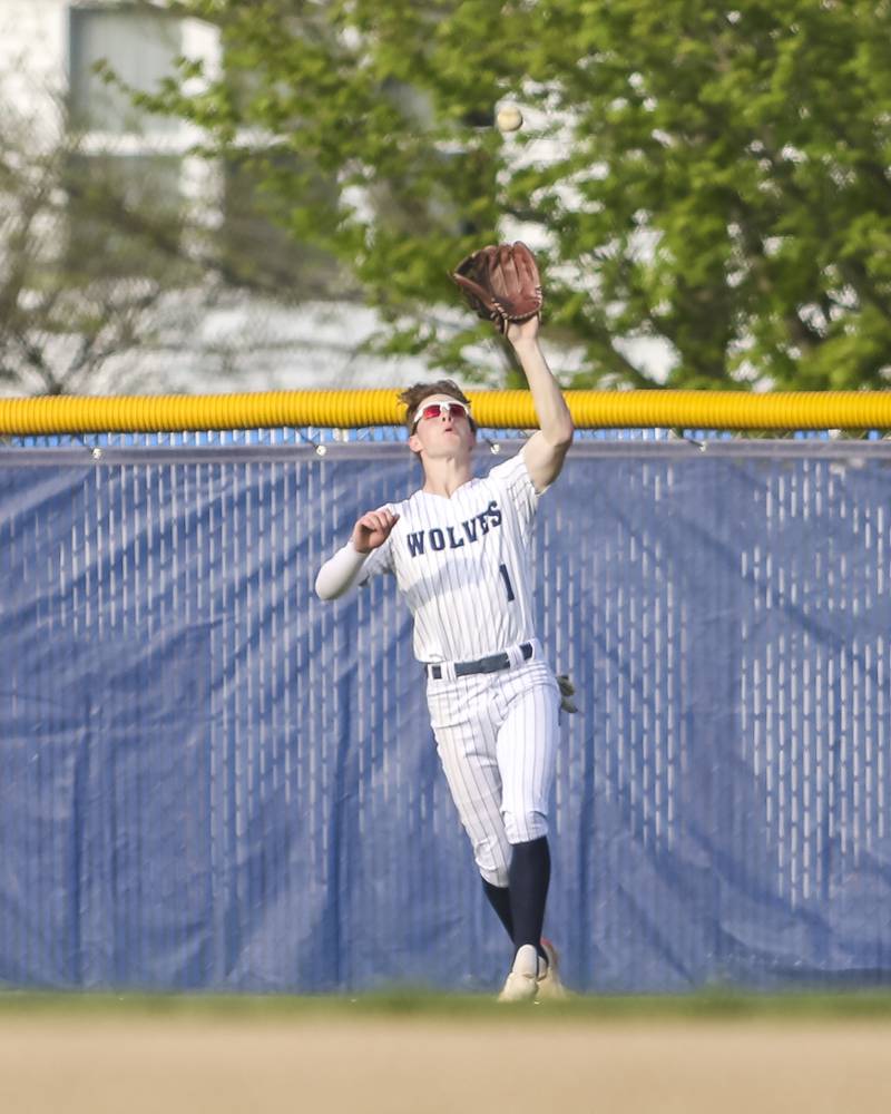 Oswego East's Colin Sadauskas (1) makes an outfield catch during baseball game between Plainfield North at Oswego East, Monday, April 28, 2025 in Oswego.