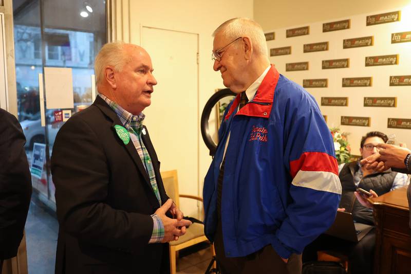 Dan Brady, Republican candidate for Secretary of State, and Ed Petka talk at the GOP event at Its Amazing in Joliet on Monday.