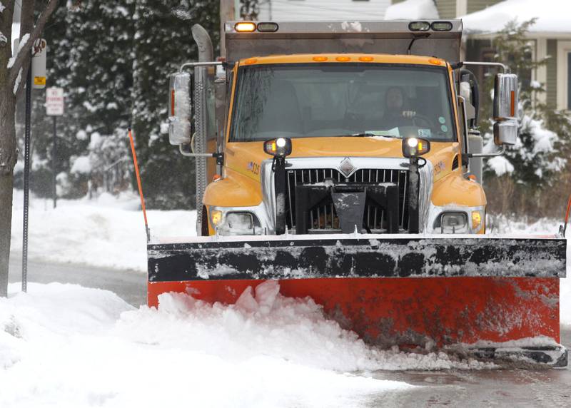 A plow driver clears snow along LaFox River Drive on Sunday, Dec. 7, 2025 in Algonquin.