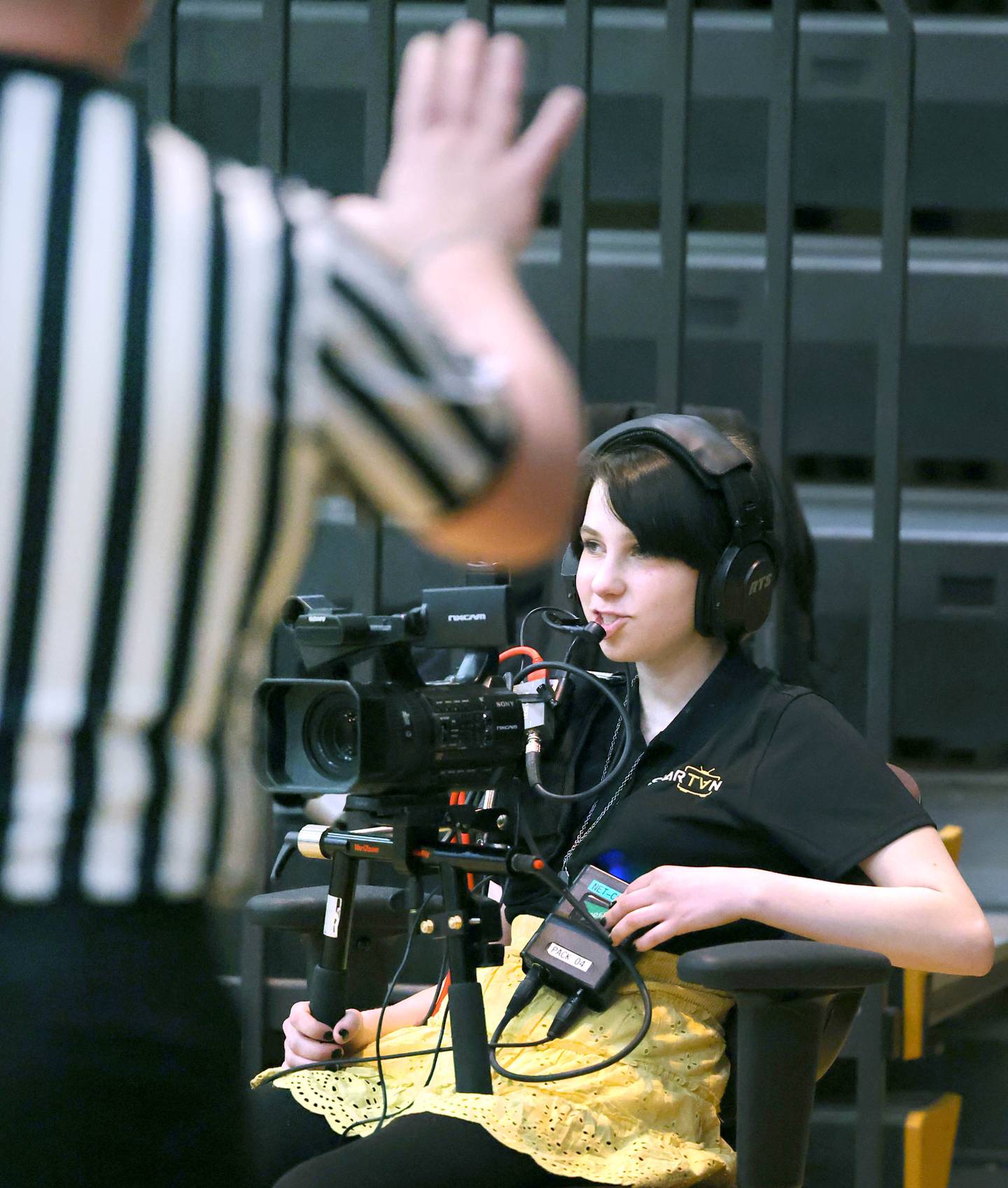 Ash Weydert, a sophomore at Sycamore High School, operates the camera during a girls basketball game Friday, Feb. 17, 2023, in the gym at the school.