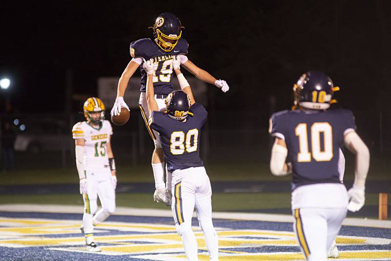 Sterling’s Mason Emin is hoisted after an early third quarter touchdown Friday, Sept. 23, 2022 against Geneseo.