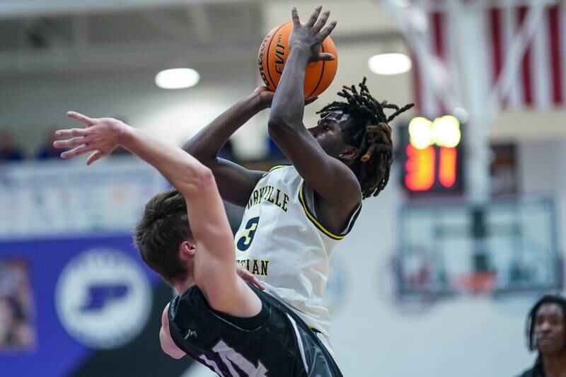 Yorkville Christian's Jayden Riley (3) shoots the ball over Kaneland’s Luke Reinert (24) during a championship final basketball game in the 61st annual Plano Christmas Classic at Plano High School on Saturday, January 1, 2017.