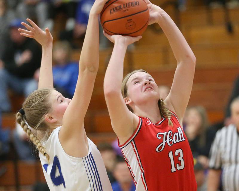 Hall's Caroline Morris has her shot blocked by Princeton's Payton Brandt during the Princeton Holiday Girls Basketball Tournament on Friday, Nov. 23, 2024 at Princeton High School.