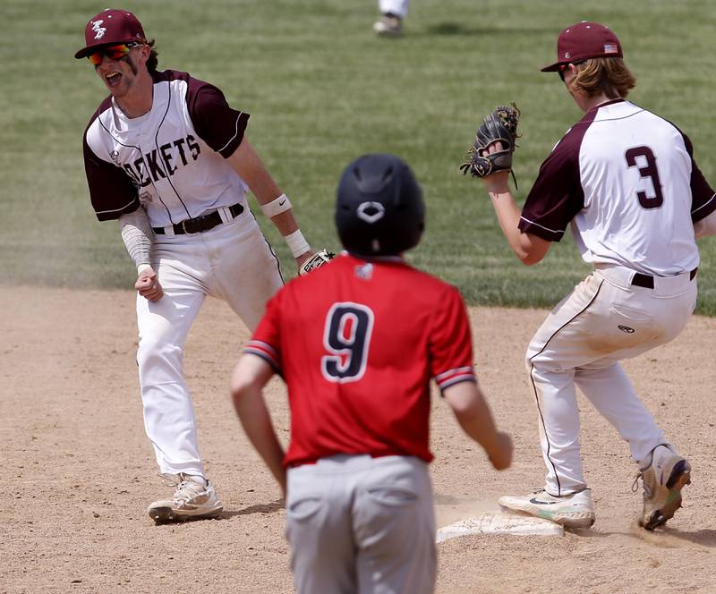 Richmon-Burton’s Connor Wallace smiles as his teammate’s Kaden Mrowiec steps on the second base to end the game during a IHSA Class 2A supersectional baseball game between Richmond-Burton and Timothy Christian at the Rockford Rivets Stadium in Rockford.