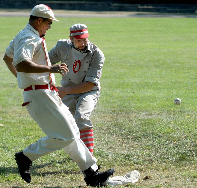 Oregon Ganymede first baseman Tim Strohecker watches the ball as a Lah-De-Dah player reaches the base safely at the World Tournament of Historic Base Ball held at the Henry Ford Museum's Greenfield Village on Sunday. Aug. 10, 2025.