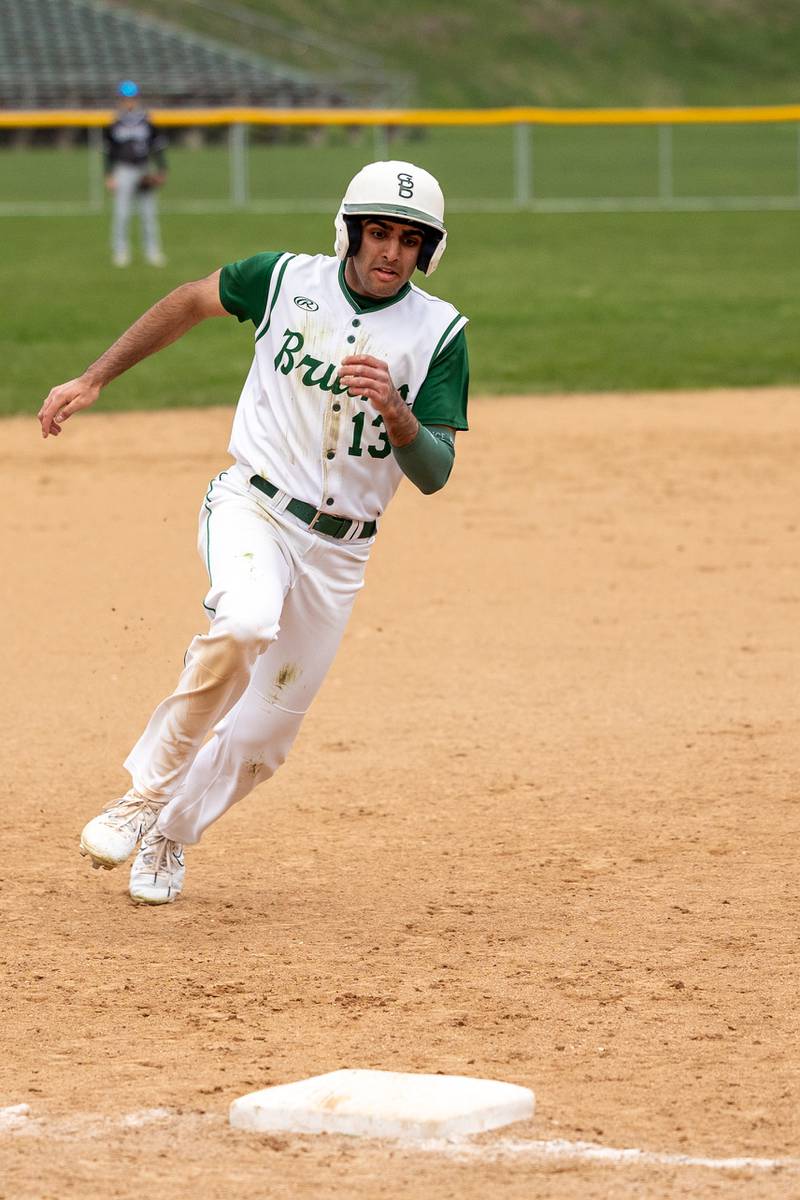 Ranbir Saini (13) of St. Bede runs to third base on Thursday, April 10, 2025 at St. Bede High School in Peru.