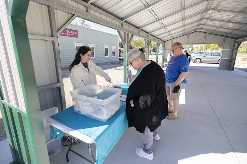 Rock Falls Chamber of Commerce program coordinator Marissa Razo (left) speaks with customers Wednesday, May 1, 2024 in the new Rock Falls’ Farmers Market pavilion. The shelter officially opened Wednesday for the upcoming season. The market is open on Wednesdays and Saturdays from 7 a.m.-1 p.m.