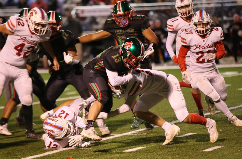 L-P's Brady Romagnoli runs the ball up the middle as Ottawa defenders Luke Boaz and Archer Cechowicz on Friday, Oct. 6, 2023 at Howard Fellows Stadium.
