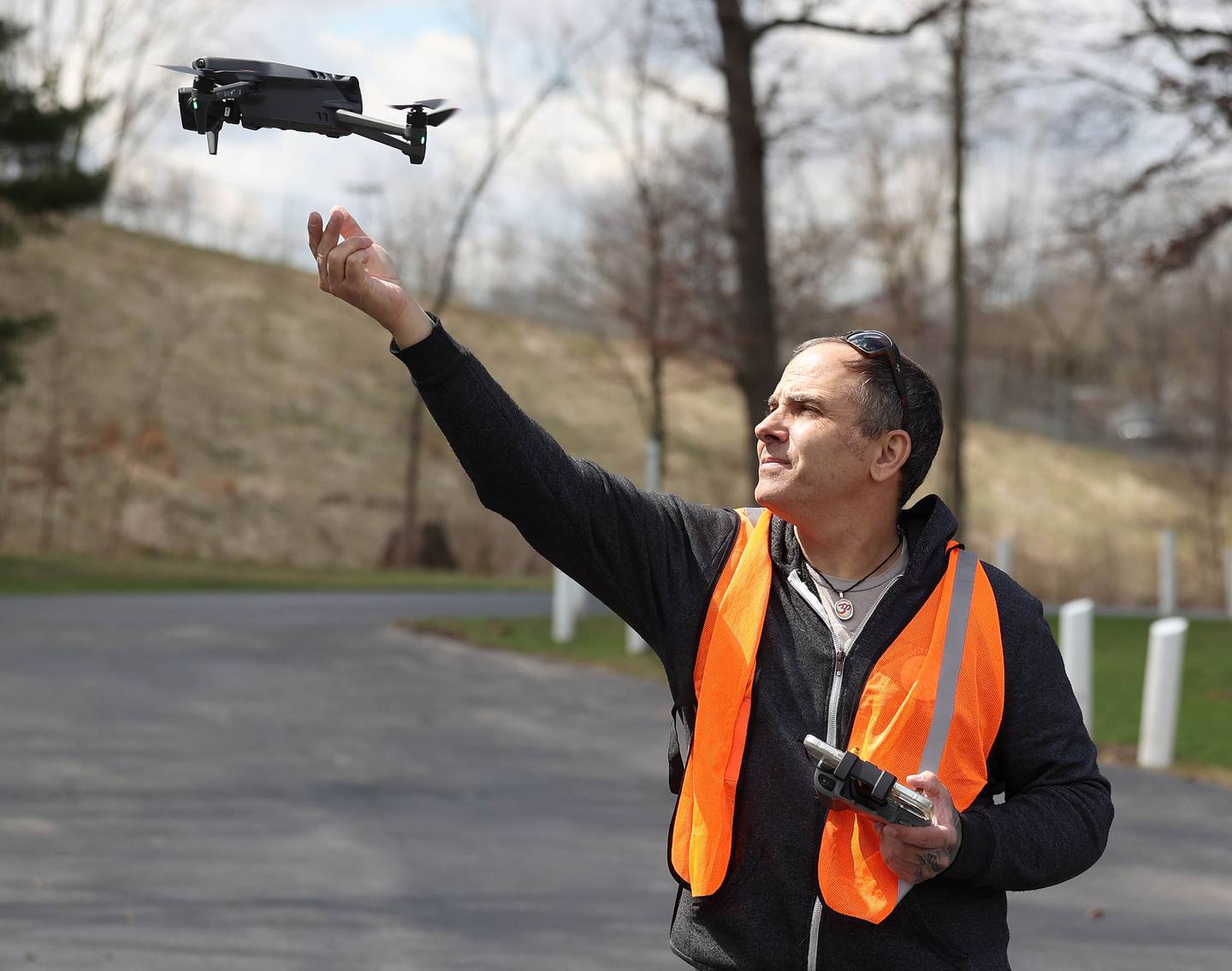 Anthony Tortoriello, of DeKalb, lands his drone in his hand Monday, April 6, 2026, at Hopkins Park in DeKalb.