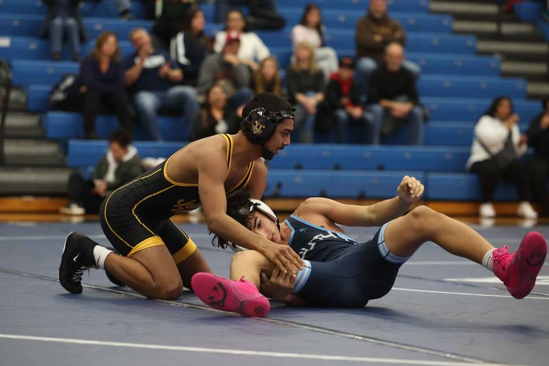 Joliet West’s Adrian Hernandez gets up after pinning Plainfield South’s Jimmy Medina in the first round in the 138-pound match on Wednesday, Dec. 11, 2024 in Plainfield.