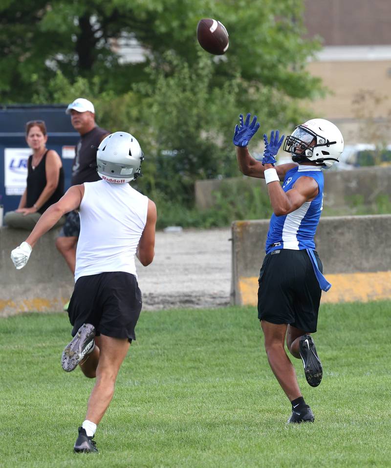 Geneva’s Talyn Taylor catches a touchdown pass Tuesday, July 16, 2024, during their matchup with Kaneland in the Kaneland 7-on-7 at the school in Maple Park.