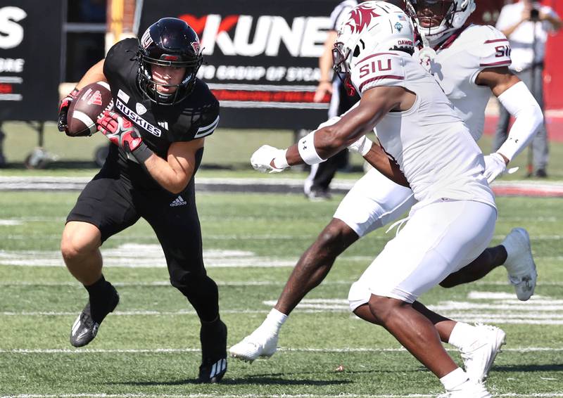 Northern Illinois' Kacper Rutkiewicz gets outside of two Southern Illinois defenders during their game Saturday, Sept. 9, 2023, in Huskie Stadium at NIU in DeKalb.