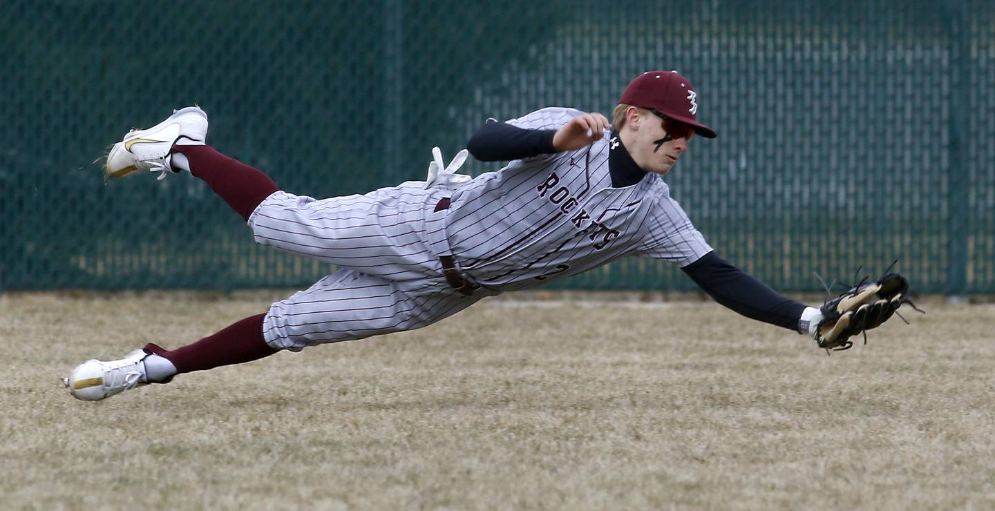 Richmond-Burton’s Carsten Szumanski makes a diving catch during a nonconference baseball game against Crystal Lake South Friday, March 24, 2023, at Crystal Lake South High School.