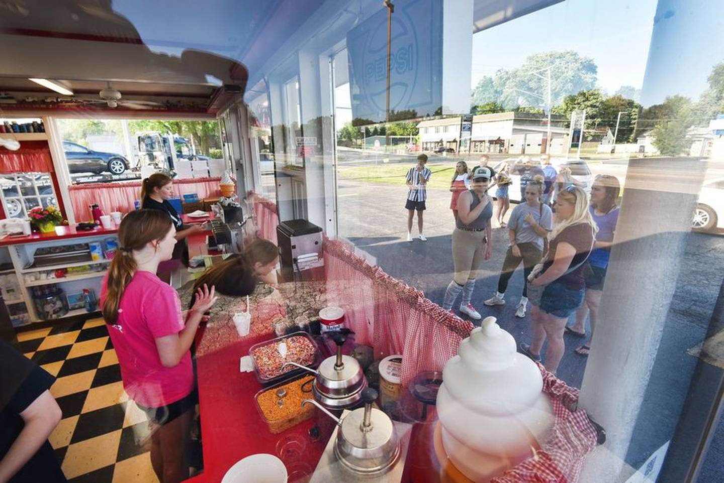 Every evening a crowd gathers at Alice's Place in Elburn. The ice cream shop closes in the winter months and reopens in the spring.