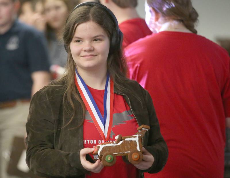 Bella Vandenberg of Princeton Christian Academy, holds her edible car before racing it during the 29th annual Edible Car Contest on Wednesday, Feb. 26, 2025 in the cafeteria at Illinois Valley Community College.