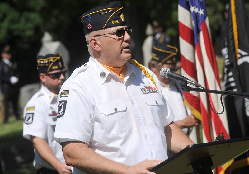 Oswego American Legion Post 675 Commander Kris Kearns speaks to the crowd gathered at the Township Cemetery during the annual Memorial Day Parade and Service, Monday, May 29, 2023.