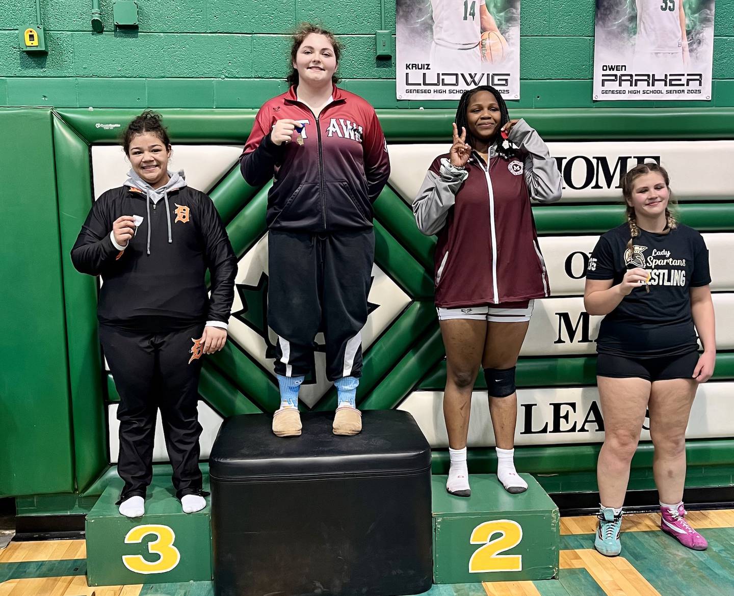 Ottawa's Juliana Thrush stands atop the podium after winning the 235-pound title at the Geneseo Sectional on Saturday, Feb. 15, 2025.